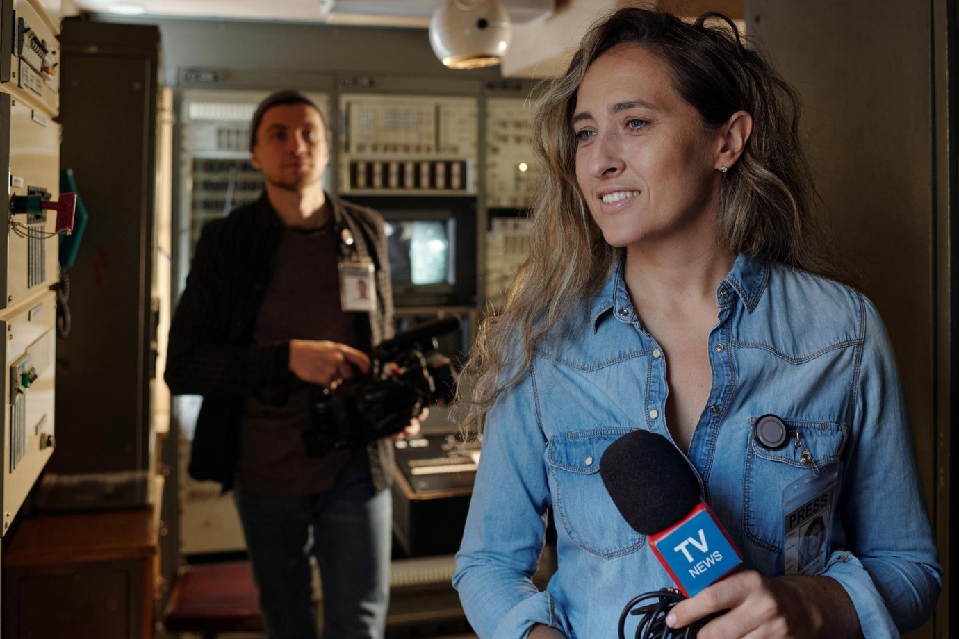 TV journalist with microphone covering a distributed press release